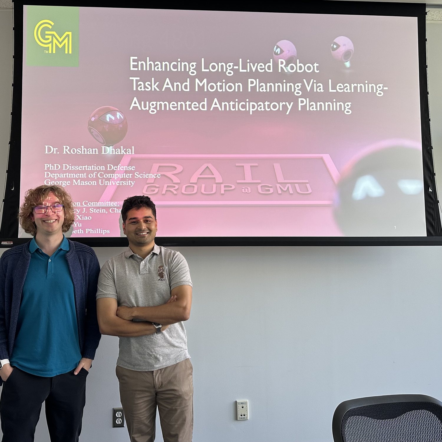 Roshan Dhakal with his advisor Gregory J. Stein after his PhD dissertation defense